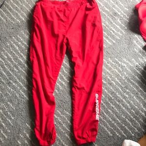 red supreme pants